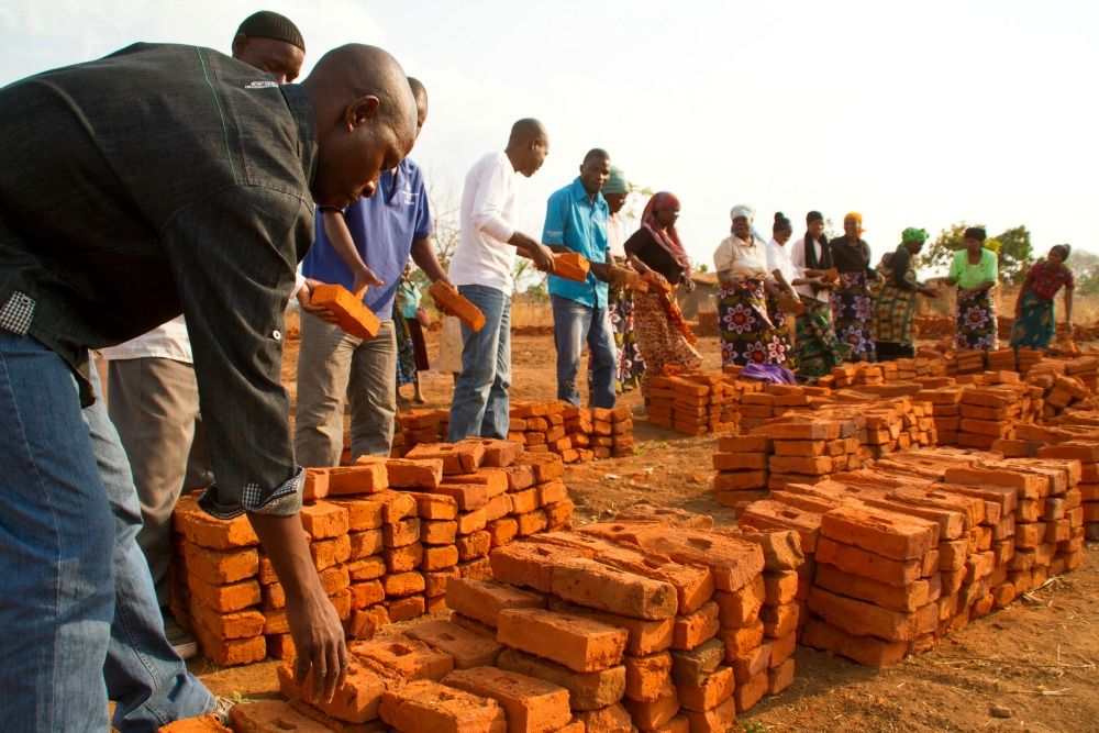 A community in Malawi building an ECD center. Used in World AIDS Day 2015 blog post