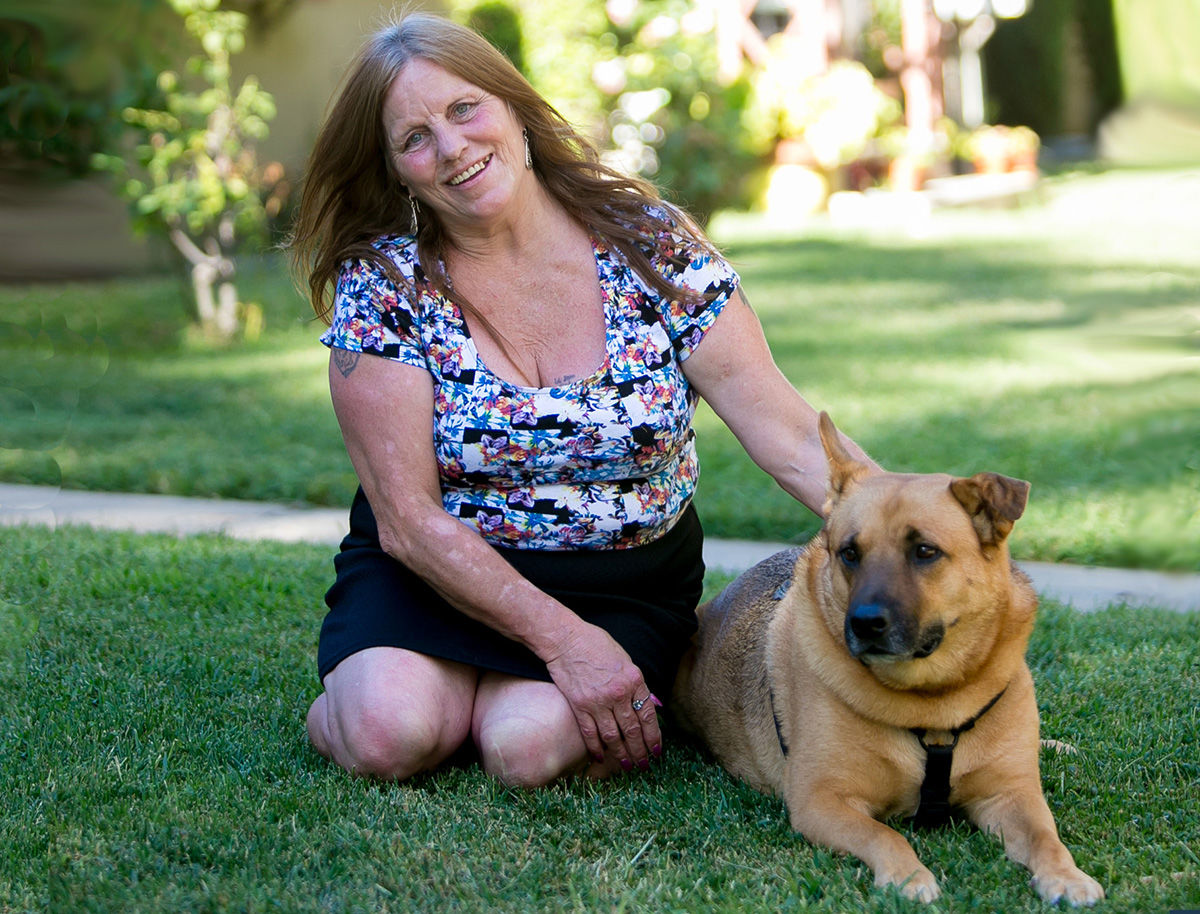 Dorothy Edwards, pictured here with her dog Gunnar, experienced homelessness firsthand. She now has a home and serves as an advocate on the board of the Corporation for Supportive Housing.
