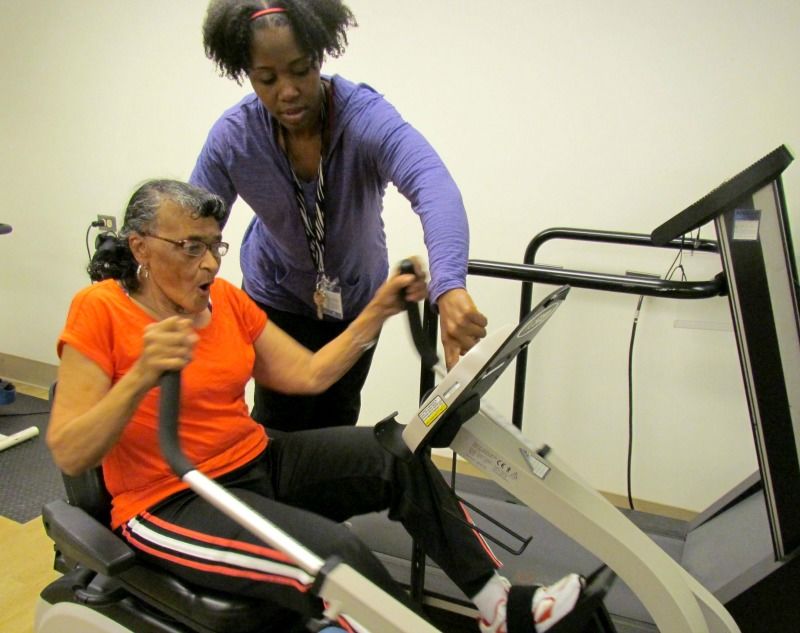 Mary exercising on an adaptive machine